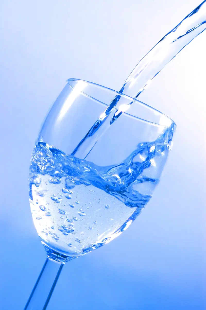 Clear filtered water pouring into a glass