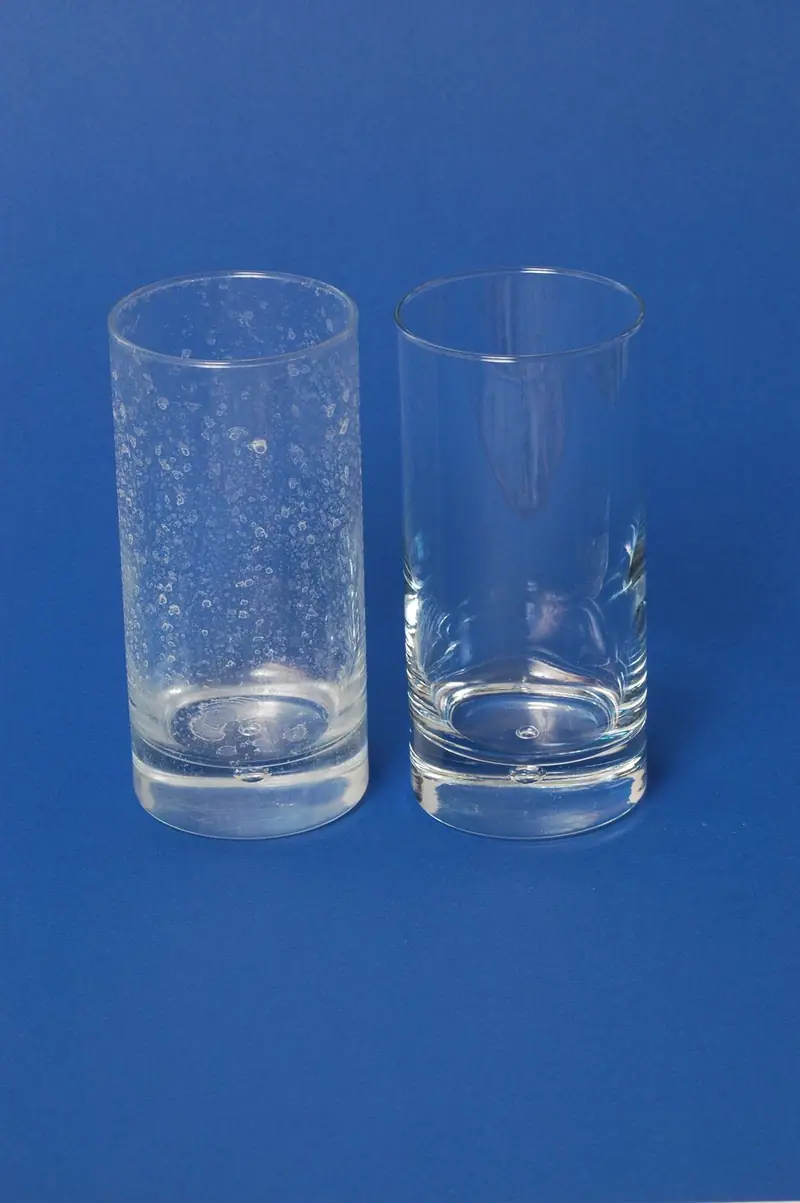 Two clear drinking glasses with no water spots