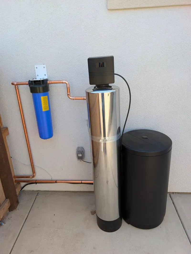 Stainless water softener with a Big Blue filter, installed by Liquid Solutions Inc