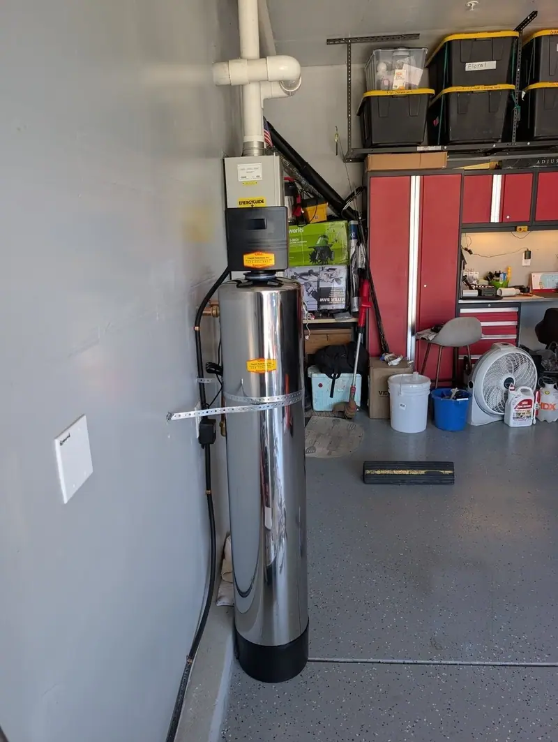 Stainless whole house carbon water filter tank installed by Liquid Solutions Inc