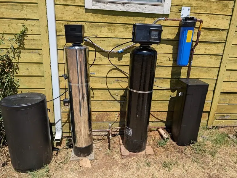 Water softener, filter tank and Big Blue housing installed by Liquid Solutions Inc