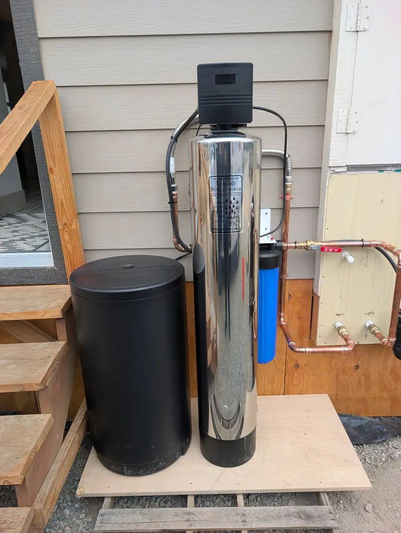 Stainless water softener and brine tank installed by Liquid Solutions Inc