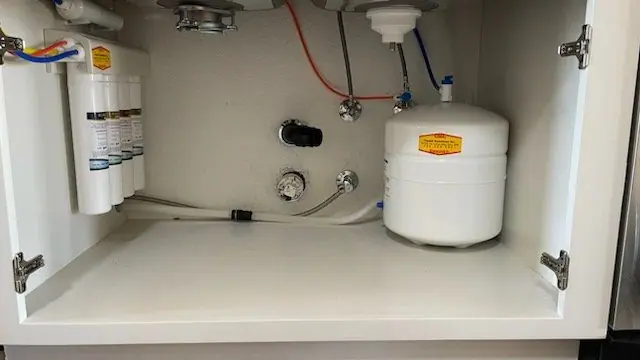 Under-sink reverse osmosis system with filter housings and storage tank, Lathrop area