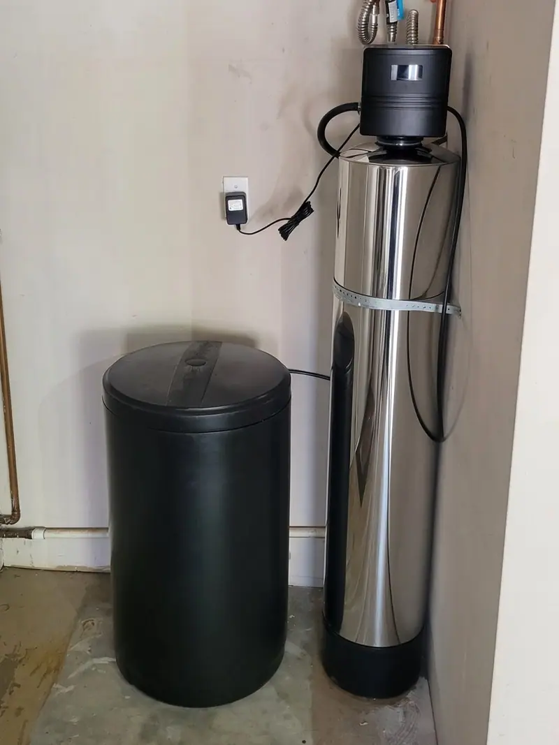 Water softener and brine tank installed by Liquid Solutions Inc