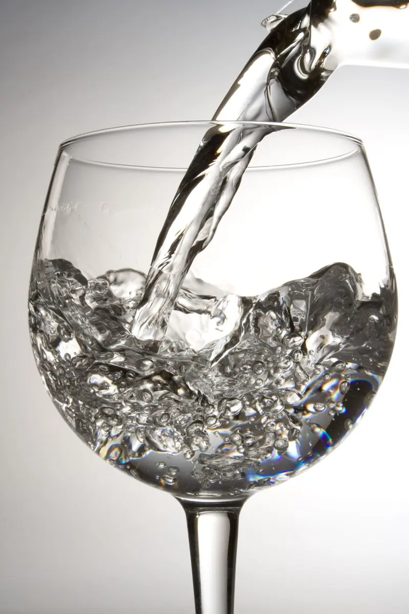 Clear water being poured into a glass