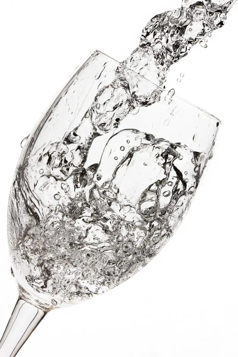 Clear water pouring into a wine glass, Lodi area